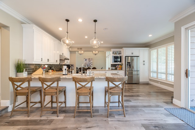 kitchen with wooden chairs at island