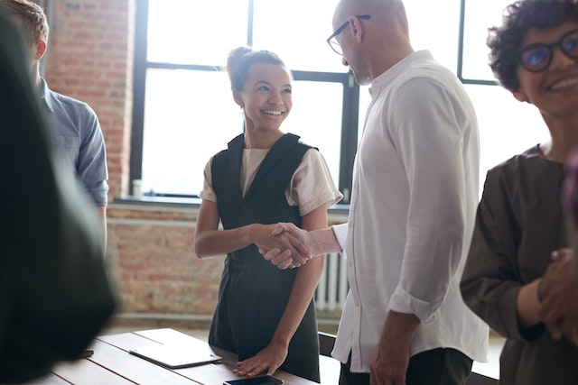 people meeting and shaking hands