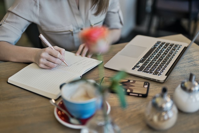 landlord taking notes at table