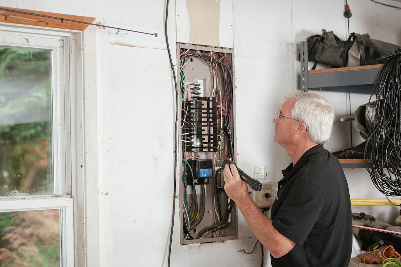person checks breaker box