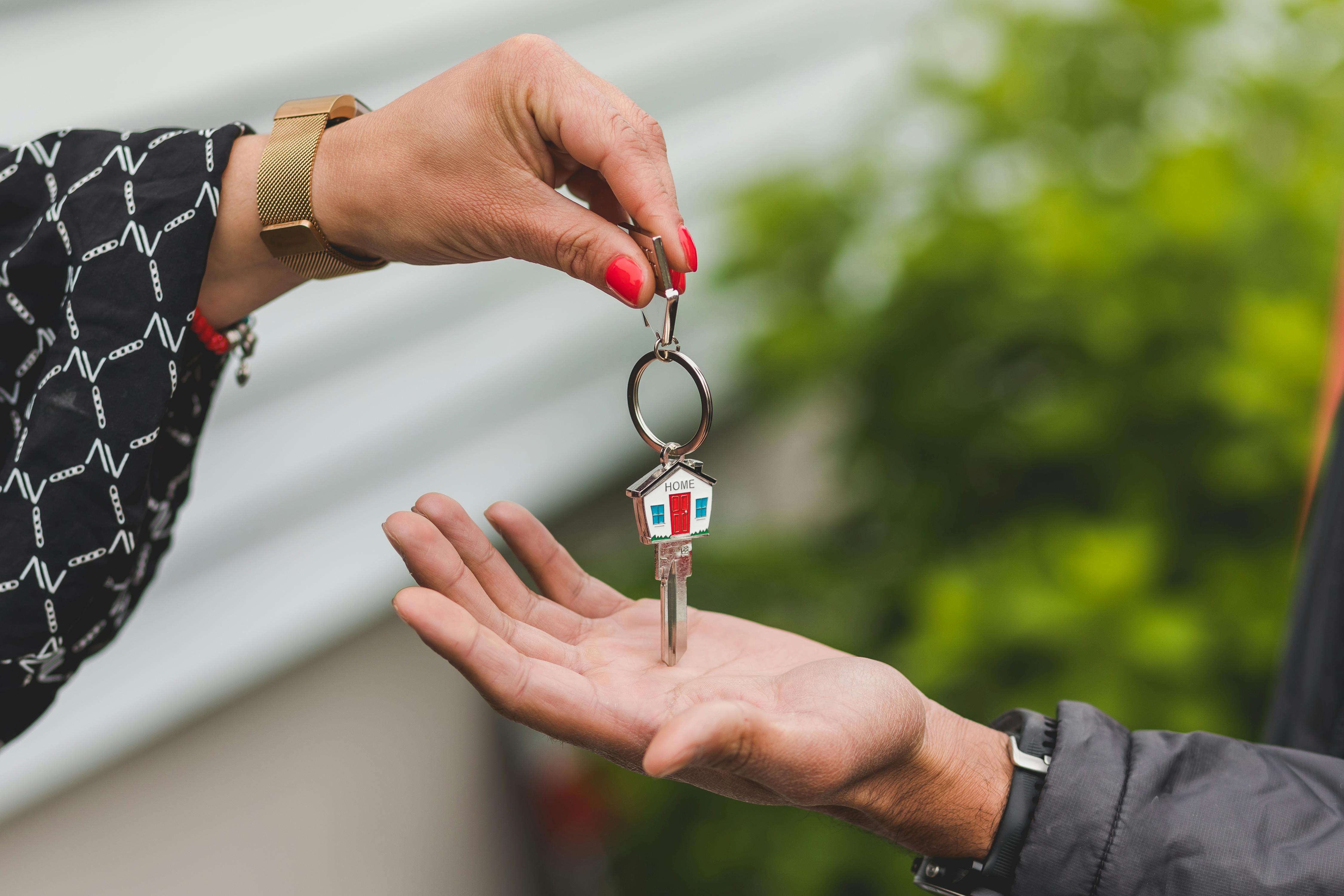 handing keys to a home
